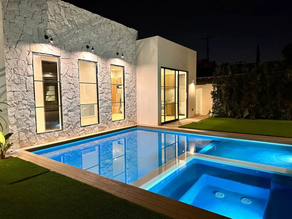 New modern Poll with wooden Deck and turf around