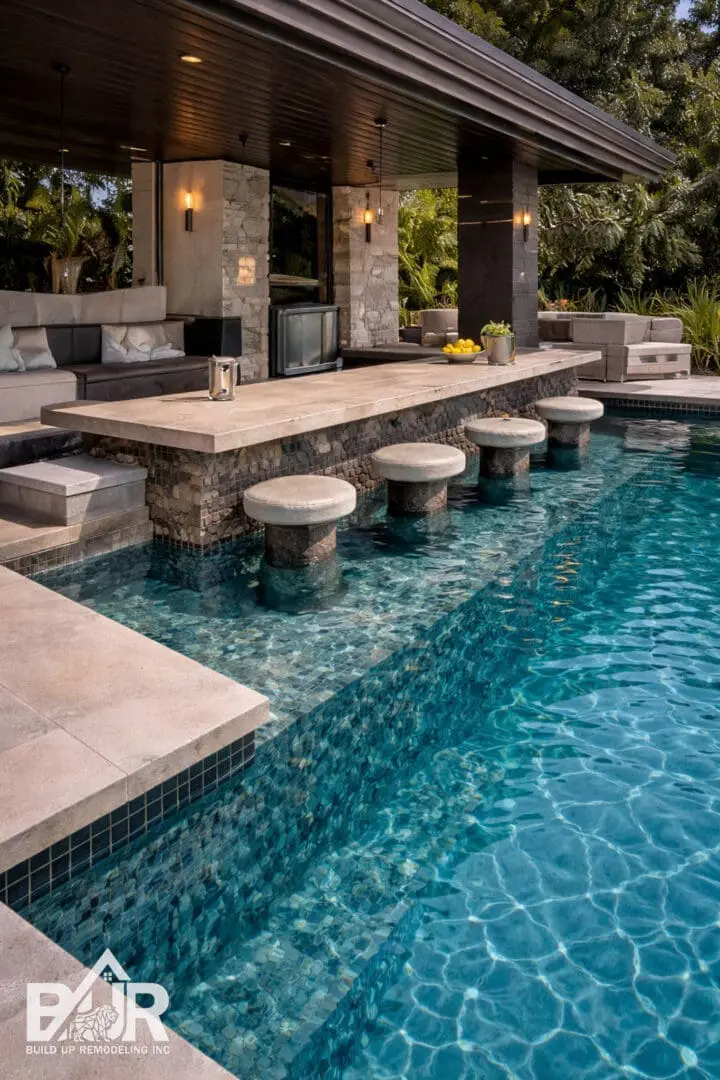 Luxury poolside bar with stone stools.