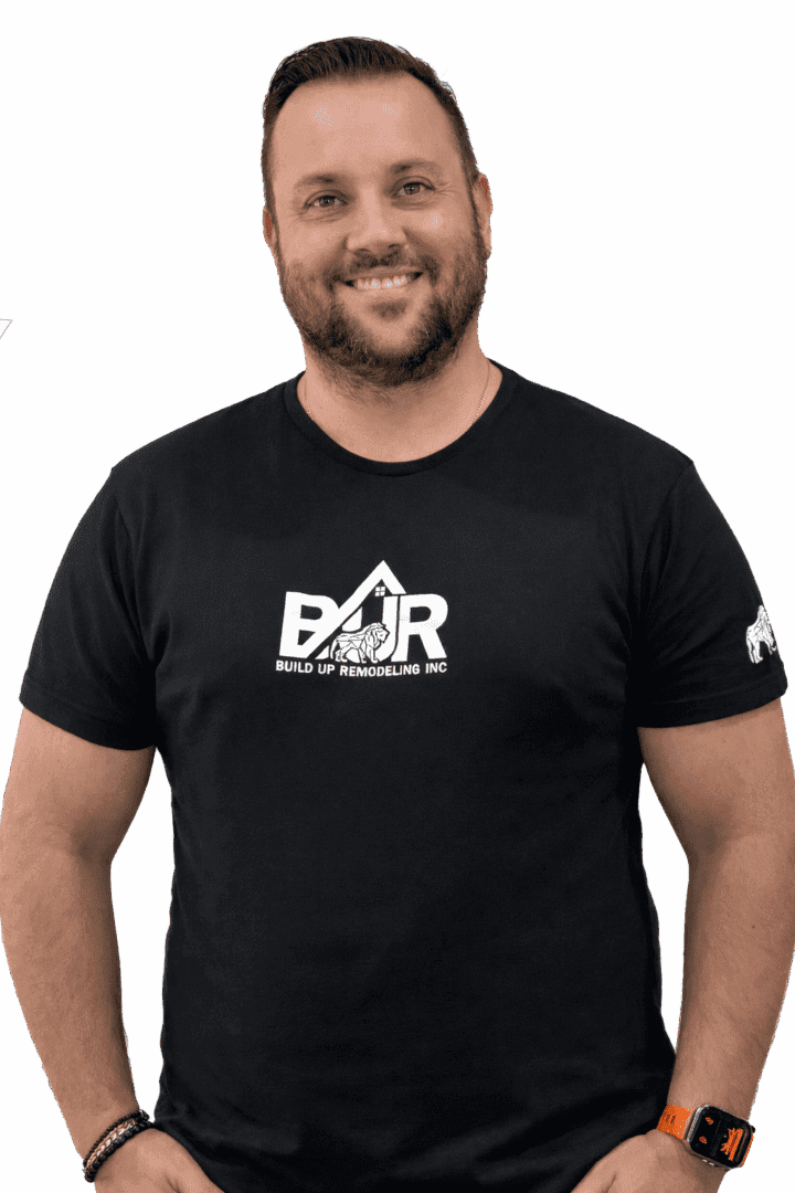 Smiling man wearing a black BAR t-shirt.