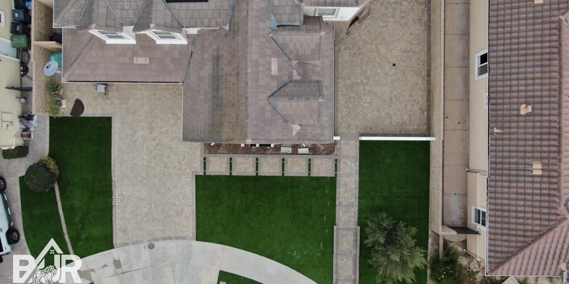 front yard remodeling with pavers and turf , view from above